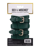 BB Store emerald green polyurethane cuffs with gold hardware and cutout detailing. Adjustable buckle closure.