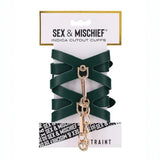 BB Store emerald green faux leather Indica Cutout Cuffs with gold chain and adjustable buckle closure.